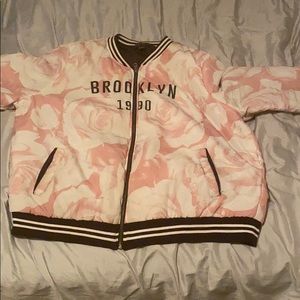 A baby pink bomber jacket